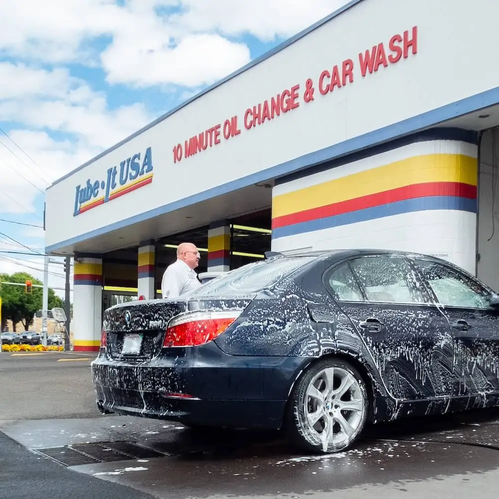 Technician performing car wash in Eugene Oregon